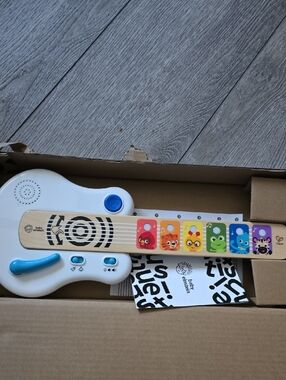 Baby Einstein Strum Along Songs Magic Touch Wooden Toy Guitar with Whammy Bar